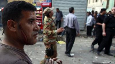 Injured Christian in Cairo street following clashes with Muslims