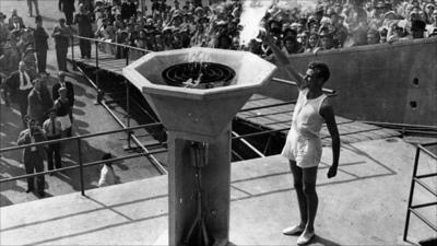 Lighting the Olympic flame