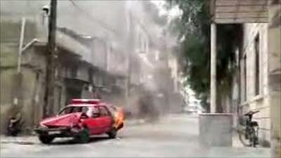 Burning car during protests n Homs, Syria