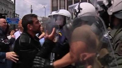 Protester and police in Greece