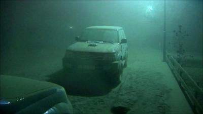 Car covered in ash