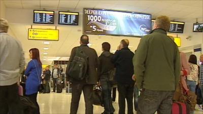 People looking at flight information