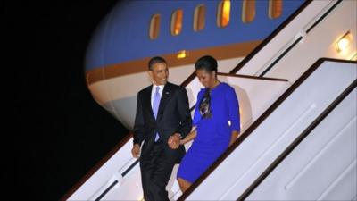 US President Barack Obama and First Lady Michelle Obama disembark from Air Force One at Stansted airport