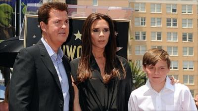 Simon Fuller, Victoria Beckham and Brooklyn Beckham.