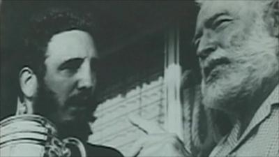 Picture of Ernest Hemingway presenting fishing trophy to Che Guevara