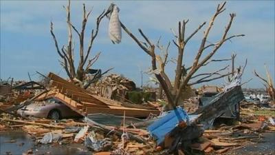 A car crushed by a tree in Joplin