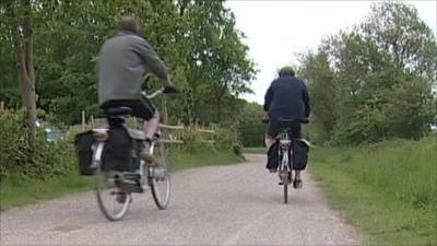 Men riding electric bikes