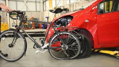 Professor Donal McNally's bike and the car that hit it. Photo: Nottinghamshire Police