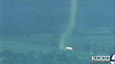 Twister approaching a parked truck
