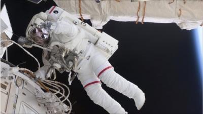 Space shuttle Endeavour astronaut Andrew Feustel works outside the International Space Station