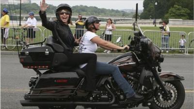 Sarah Palin on back of motorbike