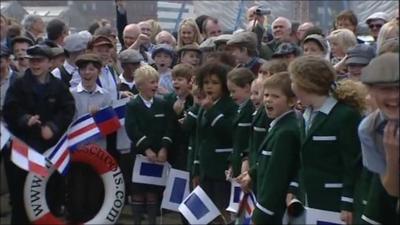 Children cheering at event to remember Titanic's launch