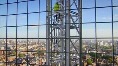 Andrew Marr climbs a crane to get above the Shard