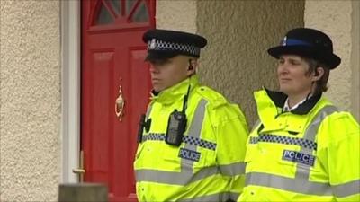 Police officers outside the house in Braintree where the shooting occurred