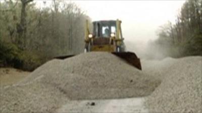 Bulldozer clearing ash