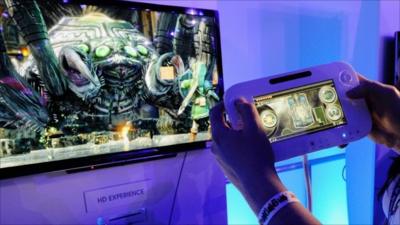 Wii U controller in front of HD TV while game is played at E3, Los Angeles