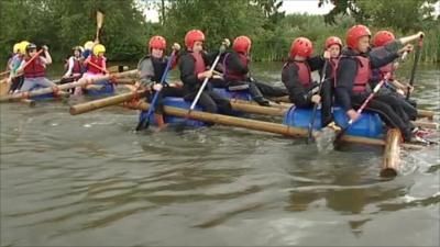 Group of children rafting