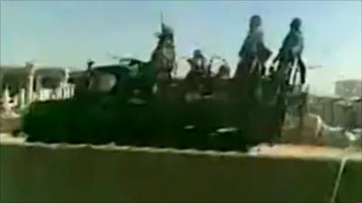 Syrian troops on back of vehicle