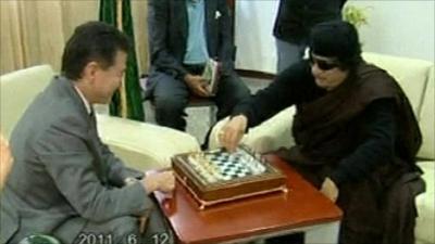 Col Gaddafi playing chess with World Chess Federation president Kirsan Ilyumzhinov