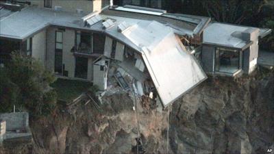 Quake-damaged cliff-top house