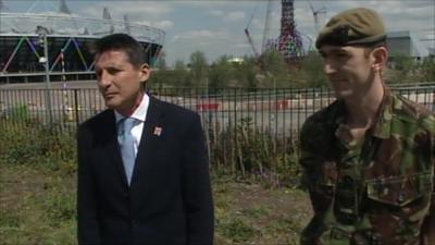 Lord Sebastian Coe, Chairman of London 2012, and Sergeant Chris Osborne from the Princess of Wales Royal Regiment