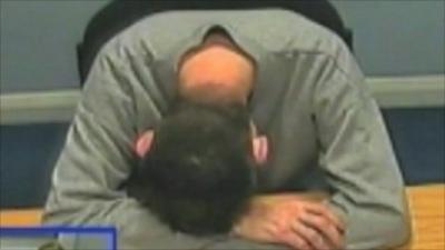 Nigel Leat buries his head during police interview