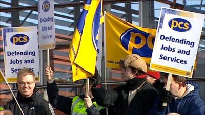 PCS union members with placards and flags