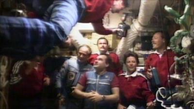 Astronauts and cosmonauts together after the shuttle docked with Mir