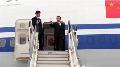 Chinese premier Wen Jiabao (right) arrives at Birmingham airport