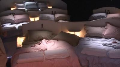 The audience sleep in beds