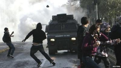 Police vehicle, demonstrators