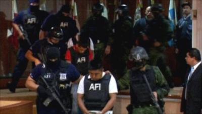 Abraham Barrios Caporal escorted by police