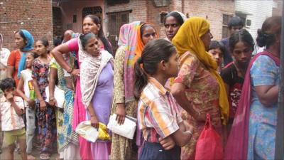 Women queue up to buy subsidised food