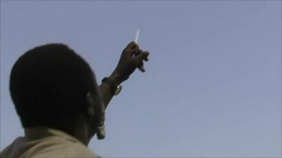 Man watching for strikes in Sudan