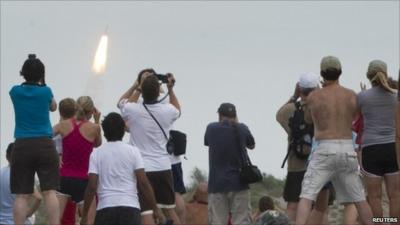 Spectators watch shuttle launch from Florida coast