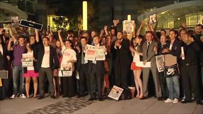 News of the World staff outside building