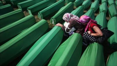 Mourners at graves