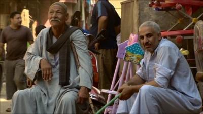 Men sitting in a street in Egypt