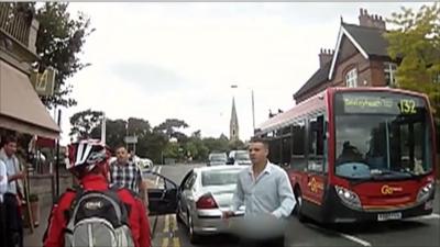The attacker emerges from his car to assault Simon Page