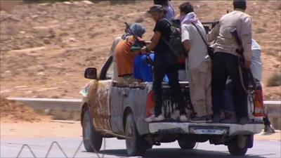 Libyan rebels retreating in the Nafusa mountains