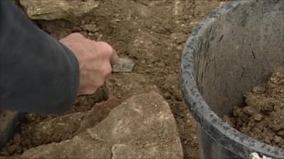 Archaeologist digging