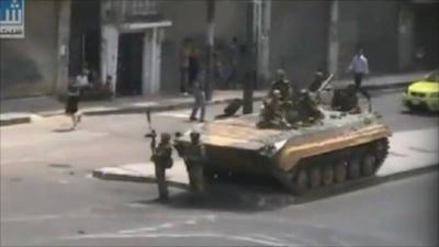 A photo sent in by a BBC News website reader of a tank on a street in Syria