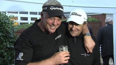 Darren Clarke celebrates with a Guinness