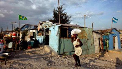 A woman walking in Port Au Prince, Haiti