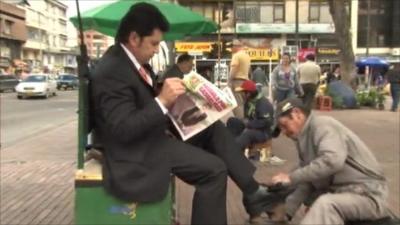 Newspaper reader in Bogota, Colombia