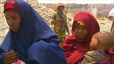 Women line up in an aid camp near Mogadishu