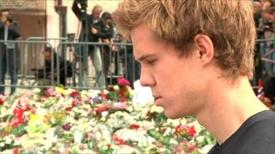 Survivor of the massacre on Utoeya island paying his respects