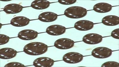 Chocolate buttons being made on production line