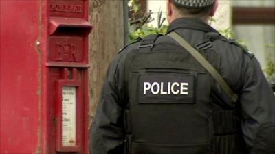 Armed police officer on guard