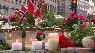 candles lit in Oslo to remember those killed in the terror attack